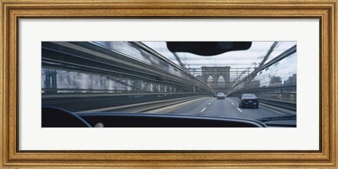 Framed Cars moving on the bridge, Brooklyn Bridge, New York City, New York State, USA Print