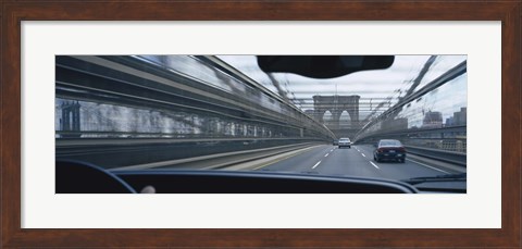 Framed Cars moving on the bridge, Brooklyn Bridge, New York City, New York State, USA Print