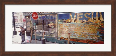 Framed USA, California, San Francisco, Little Italy, Senior man standing outside a bar Print