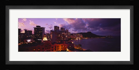 Framed Buildings lit up at dusk, Waikiki, Oahu, Hawaii, USA Print