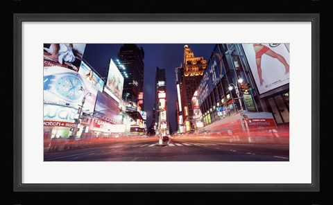 Framed Low angle view of sign boards lit up at night, Times Square, New York City, New York, USA Print