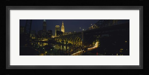 Framed Arch bridge and buildings lit up at night, Cleveland, Ohio, USA Print