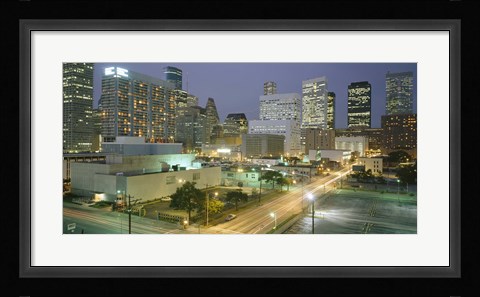 Framed Skyscrapers lit up at night, Houston, Texas Print