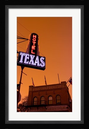 Framed Low angle view of a neon sign of a hotel lit up at dusk, Fort Worth Stockyards, Fort Worth, Texas, USA Print