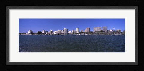 Framed Skyscrapers along a lake, Lake Merritt, Oakland, California, USA Print