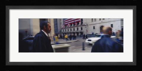 Framed Two people walking, New York Stock Exchange, Wall Street, Times Square, Manhattan, New York City, New York State, USA Print