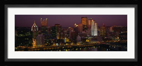 Framed High angle view of buildings lit up at night, Pittsburgh, Pennsylvania, USA Print