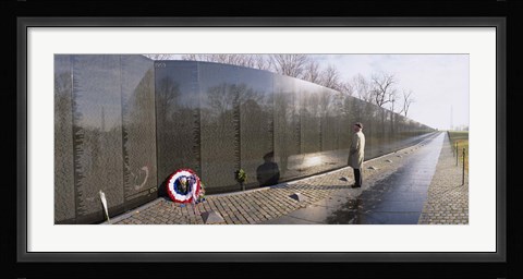 Framed Side profile of a person standing in front of a war memorial, Vietnam Veterans Memorial, Washington DC, USA Print