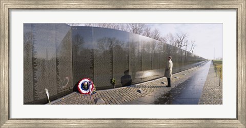 Framed Side profile of a person standing in front of a war memorial, Vietnam Veterans Memorial, Washington DC, USA Print
