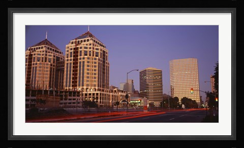 Framed USA, California, Oakland, Alameda County, New City Center, Buildings lit up at night Print