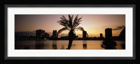 Framed Silhouette of buildings at the waterfront, Lake Eola, Summerlin Park, Orlando, Orange County, Florida, USA Print