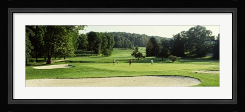 Framed Four people playing on a golf course, Baltimore County, Maryland, USA Print