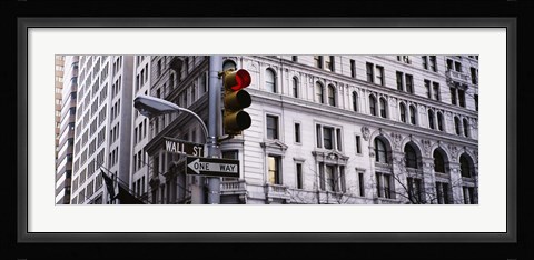 Framed Low angle view of a Red traffic light in front of a building, Wall Street, New York City Print