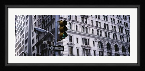 Framed Low angle view of a Green traffic light in front of a building, Wall Street, New York City Print