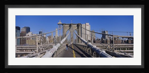 Framed Rear view of a woman walking on a bridge, Brooklyn Bridge, Manhattan, New York City, New York State, USA Print