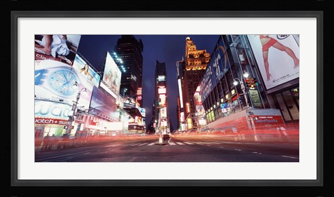 Framed Low angle view of sign boards lit up at night, Times Square, New York City, New York, USA Print