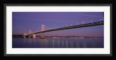 Framed Low angle view of a bridge at dusk, Oakland Bay Bridge, San Francisco, California, USA Print