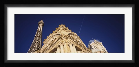Framed Low angle view of a building in front of a replica of the Eiffel Tower, Paris Hotel, Las Vegas, Nevada, USA Print