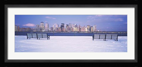Framed Park benches in snow with a city in the background, Lower Manhattan, Manhattan, New York City, New York State, USA Print