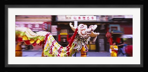 Framed Group of people performing dragon dancing on a road, Chinatown, San Francisco, California, USA Print