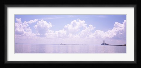 Framed Sea with a container ship and a suspension bridge in distant, Sunshine Skyway Bridge, Tampa Bay, Gulf of Mexico, Florida, USA Print