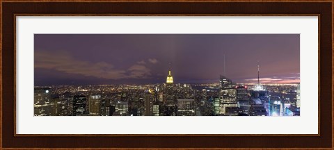 Framed Buildings in a city lit up at dusk, Midtown Manhattan, Manhattan, New York City, New York State, USA Print