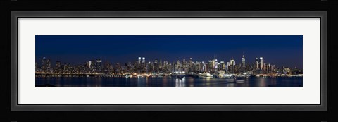 Framed Buildings in a city lit up at dusk, Hudson River, Midtown Manhattan, Manhattan, New York City, New York State, USA Print