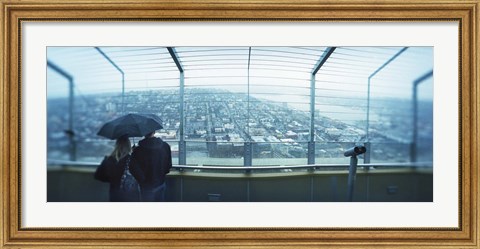 Framed Couple viewing a city from the Space Needle, Queen Anne Hill, Seattle, Washington State, USA Print