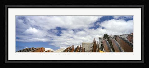 Framed Low angle view of skyscrapers and surfboards, Honolulu, Oahu, Hawaii, USA Print