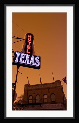 Framed Low angle view of a neon sign of a hotel lit up at dusk, Fort Worth Stockyards, Fort Worth, Texas, USA Print