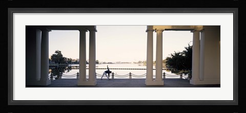 Framed Person stretching near colonnade, Lake Merritt, Oakland, Alameda County, California, USA Print