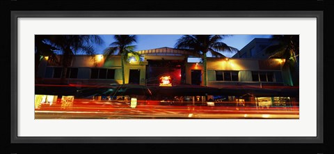 Framed Traffic in front of a building at dusk, Art Deco District, South Beach, Miami Beach, Miami-Dade County, Florida, USA Print