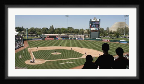Framed Spectator watching a baseball match at stadium, Raley Field, West Sacramento, Yolo County, California, USA Print