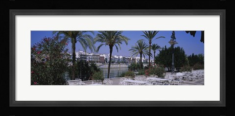 Framed Sidewalk cafe at the riverside, Guadalquivir River, Seville, Spain Print