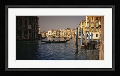 Framed Tourists sitting in a gondola, Grand Canal, Venice, Italy Print