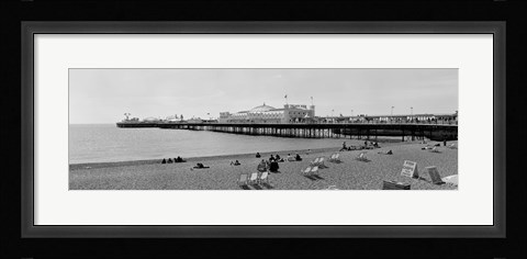 Framed Tourists on the beach, Brighton, England Print