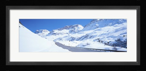 Framed Snow covered mountains on both sides of a road, St Moritz, Graubunden, Switzerland Print