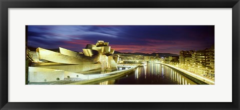 Framed Buildings lit up at dusk, Guggenheim Museum Bilbao, Bilbao, Vizcaya, Spain Print
