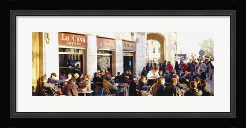 Framed Tourists sitting outside of a cafe, Barcelona, Spain Print