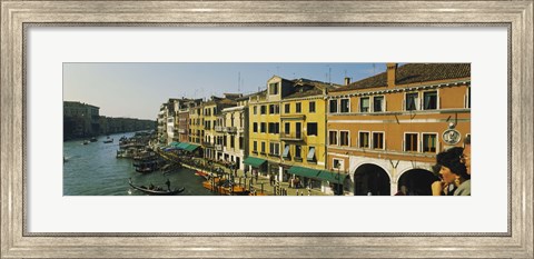 Framed Tourists looking at gondolas in a canal, Venice, Italy Print