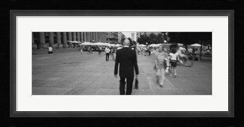 Framed Rear view of a businessman walking on the street, Stuttgart, Germany Print