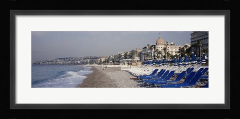 Framed Empty lounge chairs on the beach, Nice, French Riviera, France Print
