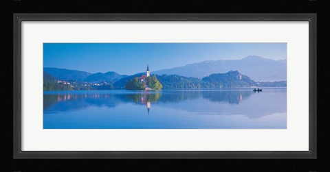 Framed Reflection of mountains and buildings in water, Lake Bled, Slovenia Print