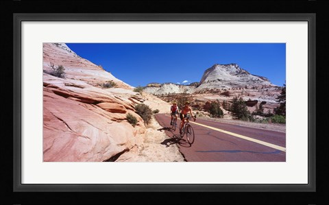 Framed Two people cycling on the road, Zion National Park, Utah, USA Print