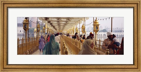 Framed Group of people walking on a bridge over a pond, Golden Temple, Amritsar, Punjab, India Print