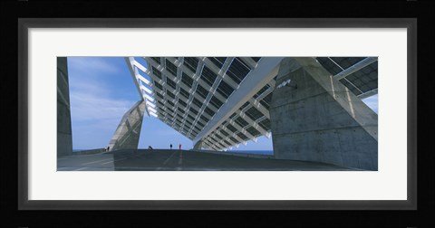 Framed Four people under a structure, Barcelona, Catalonia, Spain Print