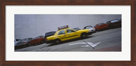 Framed Taxi running on the road, San Francisco, California, USA Print