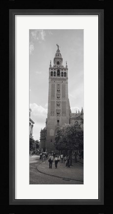 Framed Group of people walking near a church, La Giralda, Seville Cathedral, Seville, Seville Province, Andalusia, Spain Print