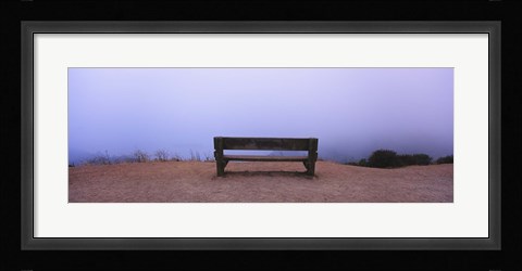 Framed Empty bench in a parking lot, California, USA Print
