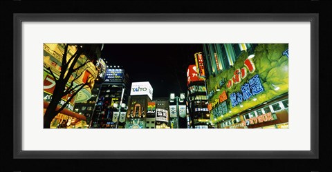 Framed Low angle view of buildings lit up at night, Shinjuku Ward, Tokyo Prefecture, Kanto Region, Japan Print